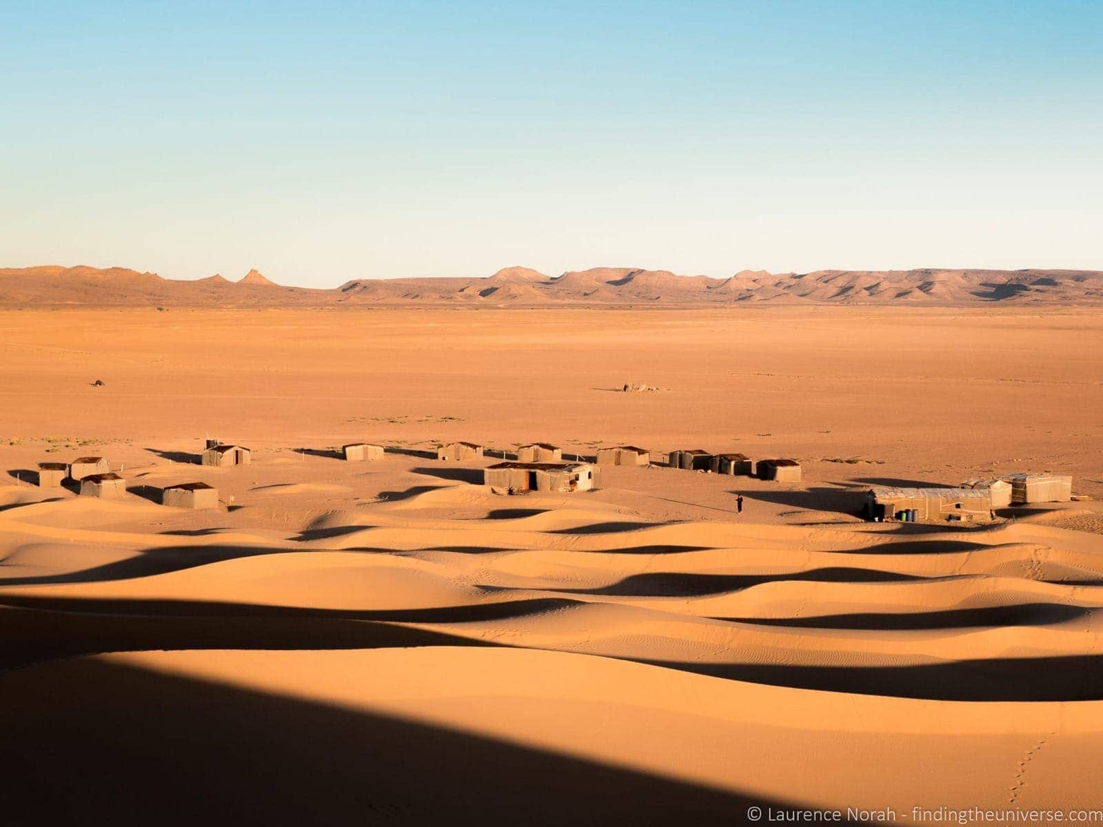 Sand dunes and village Sahara Morocco